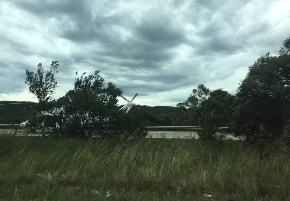 NSW Ambulance chopper landing on the Hume Highway. 