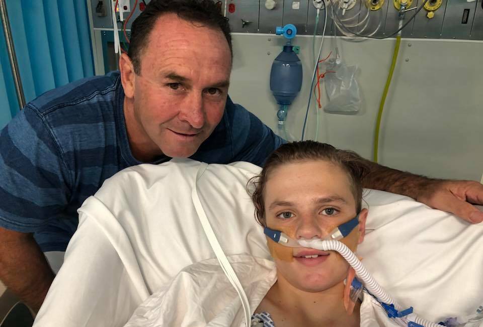 Canberra Raiders coach Ricky Stuart pays Thomas 'TJ' Campagna a visit in hospital on Christmas Day. Photo: Facebook