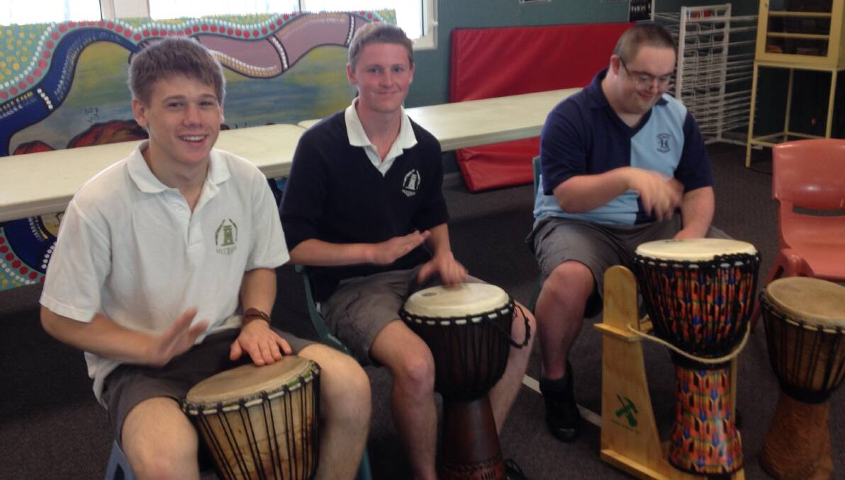 DRUMMING WORKSHOP: Lachlan Bensley,  Jye baker and  Will Elward at the all in jam session at the Crescent School recently. 