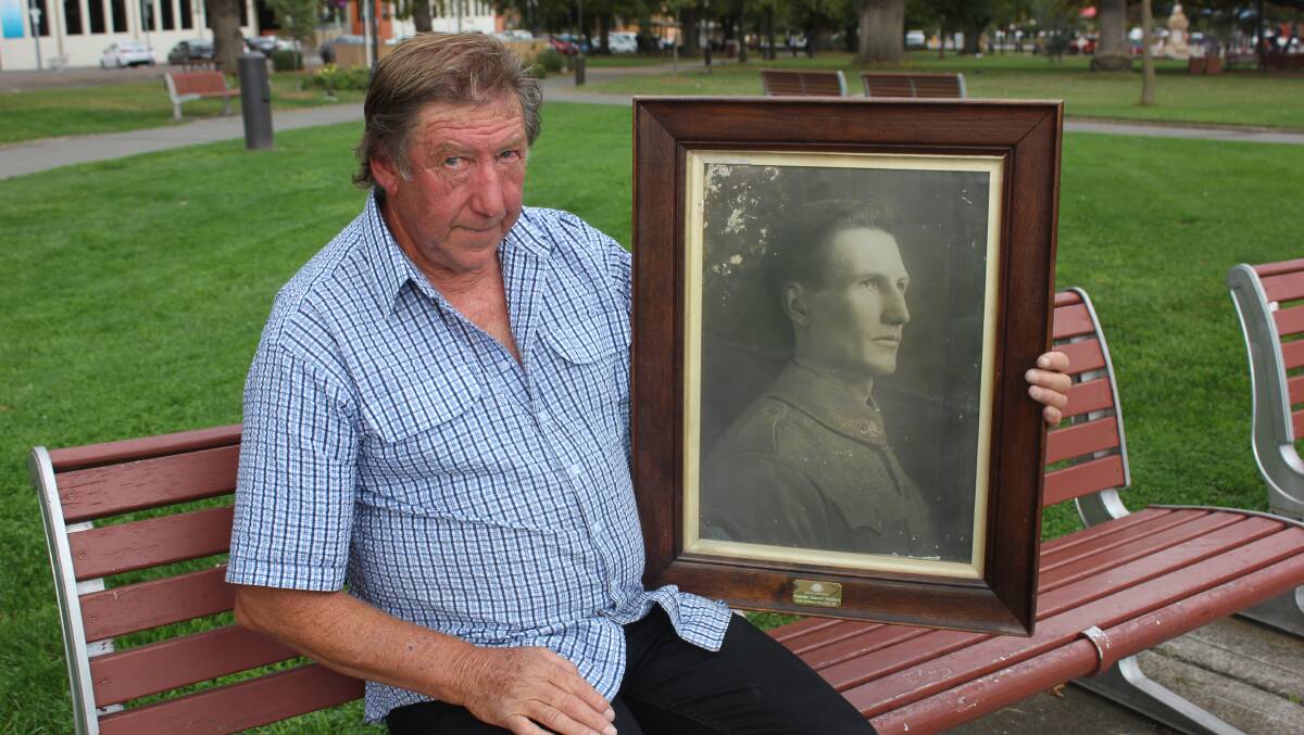 PROUD STORY: Wayne Adams with a photo of his grandfather Harrie McKenzie Adams, taken in about 1916.