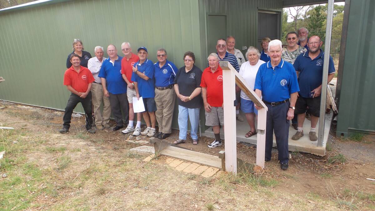 NEW SHED: Members of the Goulburn Region Woodworkers in front of their new shed on the Wheeo Road. Photo supplied. 