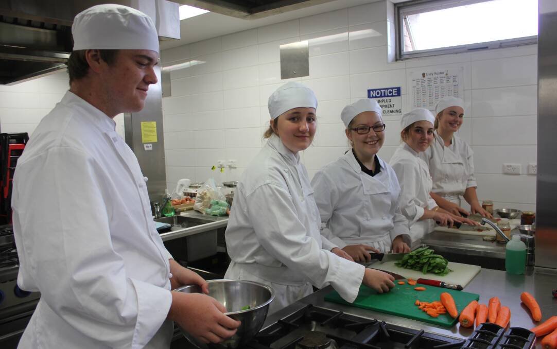 COOK UP: Year 11 and 12 students Billy Gee, Cleo Rodden, Sophie Kelly, Savannah Joukhador-Lumley and Emma Hayes preparing food for the Mulwaree on Show. 