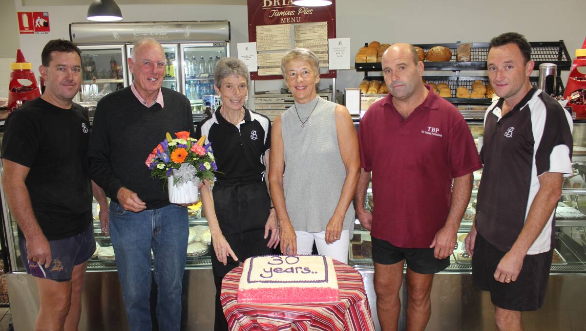 SERVICE WITH A SMILE: Tony Neate, Peter Bryant, Kerry Radburn, Margaret Bryant, Phil Sykes and Jac Cunningham at Bryant's Pies in Goulburn Square to celebrate Kerry's 30 years' service. Photo: David Cole
