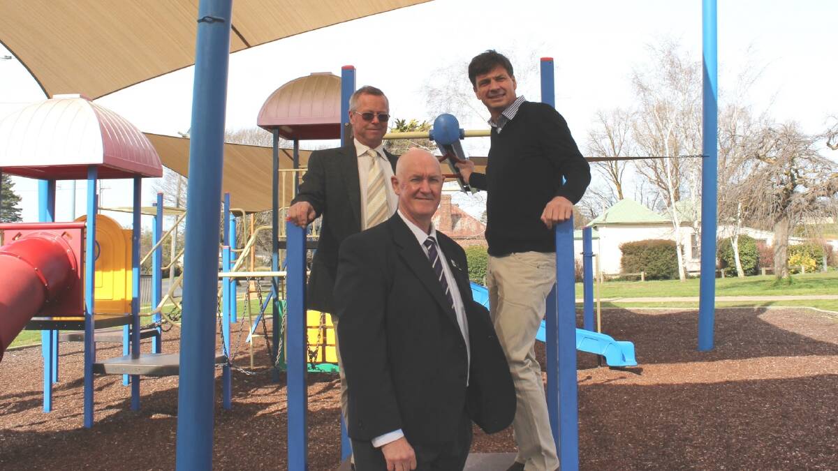 NEW EQUIPMENT: Coleman Park Crookwell is one of the parks in Upper Lachlan that will receive new eqipment courtesy of federal grant funding. Pictured at the park are Upper Lachlan Mayor John Shaw, general manager John Bell and Angus Taylor. Photo supplied. 