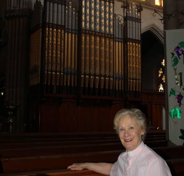 ORGAN: Canon Anne Wentzel  in front of the beautiful organ inside St Saviour's Cathedral that will be played by organist Robert Smith on the night. 