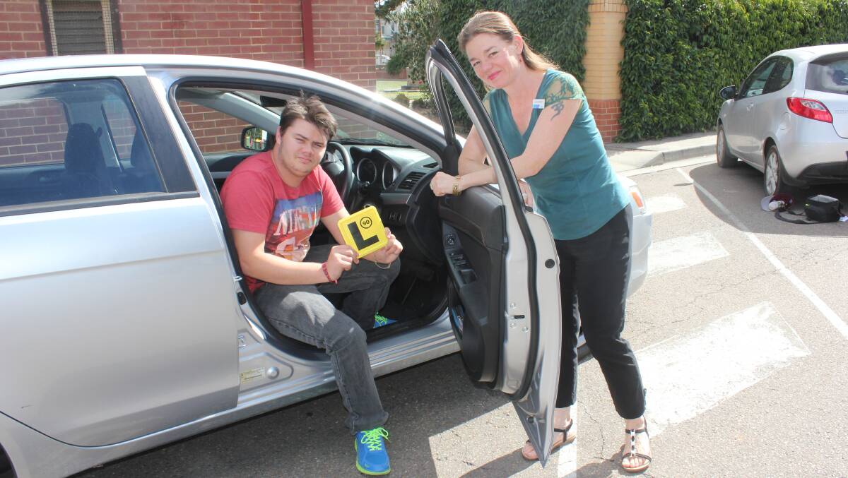 SUCCESS STORY: Former student of the TAFE Learner Driving Program Liam Caldow with teacher Niki Shepherd. Mr Caldow said the course helped him get his L-Plates. Photo David Cole. 