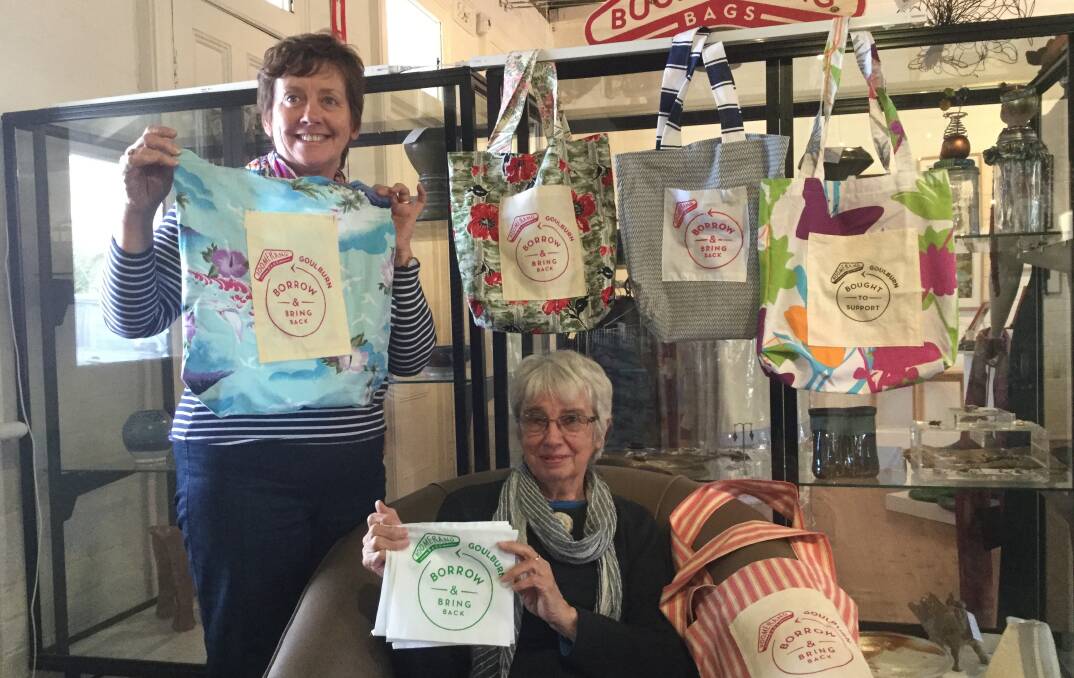 SCREEN PRINTING: Dr Ursula Stephens with Daphne Gooley at Gallery on Track, who has been screen printing the pockets for Goulburn's new Boomerang Bags.