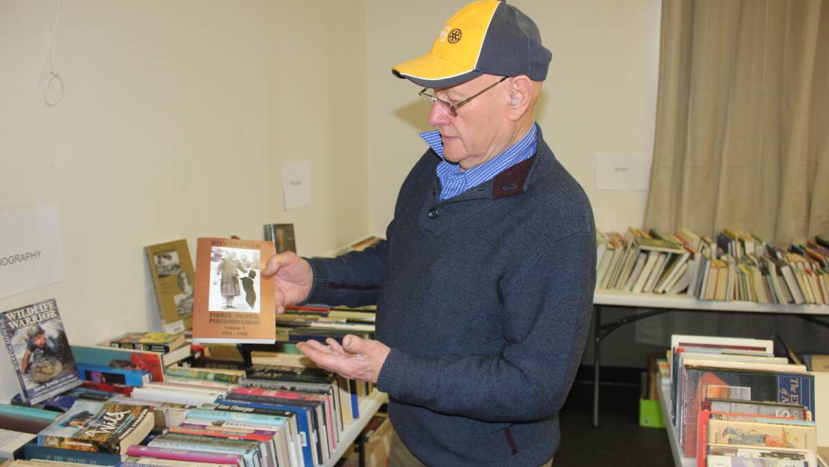 BOOKS GALORE: David Bell from Goulburn Mulwaree Rotary sorting a bundle of books at last year's for Book Fair. 