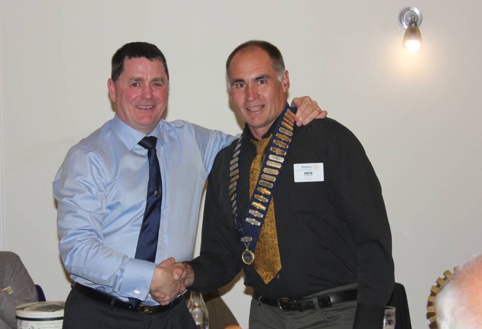 NEW PRESIDENT: Outgoing Argyle Rotary president Mick Cooper welcomes Mick Pearson to the role. 
