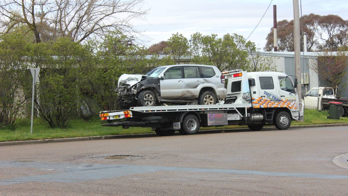 CRASH: One of the vehicles damaged in the crash at the corner of Ross St and Taralga Rd today. Photos David Cole. 