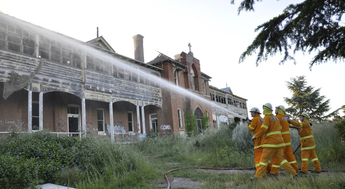 FIRIES: Members of the Rural Fire Service fighting the blaze at the former St John's Orphanage on Thursday evening. Photo Louise Thrower. 