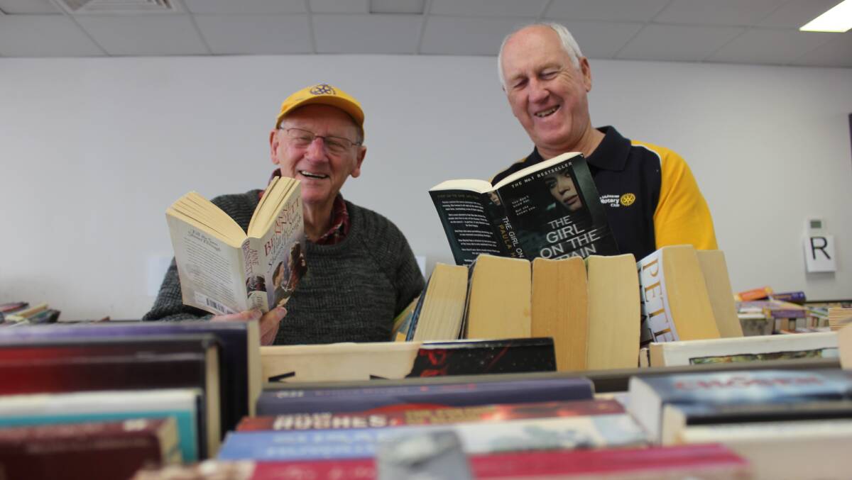 GREAT READS: Goulburn Mulwaree Rotary members Peter Bertram and Bob Chalmers catch up on some reading at the Book Fair, which opened this week. 