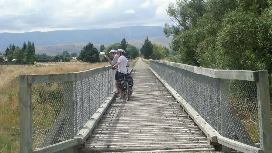 RAIL TRAIL: David Mullen with Tony Foley on the Otago Central Rail Trail in New Zealand. The Goulburn to Crookwell Rail Trail may be up for consideration again.  Photo: Pauline Mullen