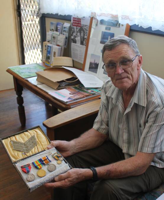 MEDALS: Phil Fowler proudly holds some of his grandfather Arthur Fowler's medals which he was awarded during World War One.