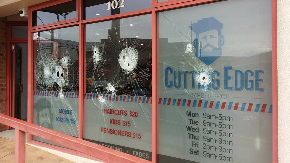 DESTROYED: Vandals took out $1150 worth of glass before fleeing the Central Road barber shop in the early hours of Saturday morning. Source: Facebook