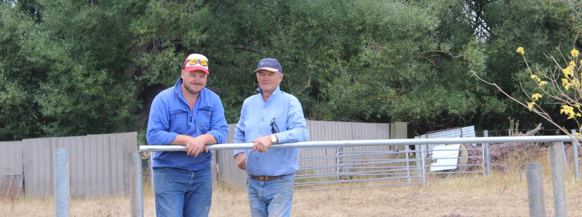 SHOWGROUND PREPARATIONS: John Corby and Nick Foster took a breather when they were erecting the dog trial arena.