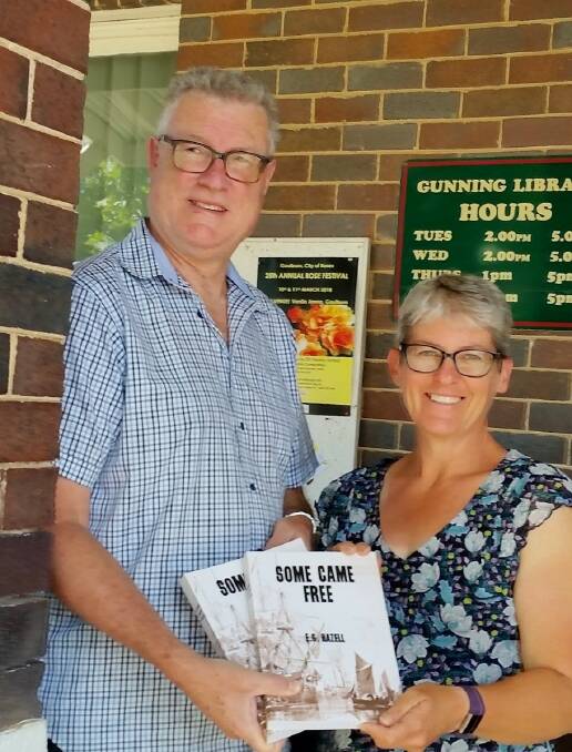 Murray Hazell presenting replacement copies of his fathers book to Peta Luck of Gunning Library. Photo: courtesy Peta Luck.