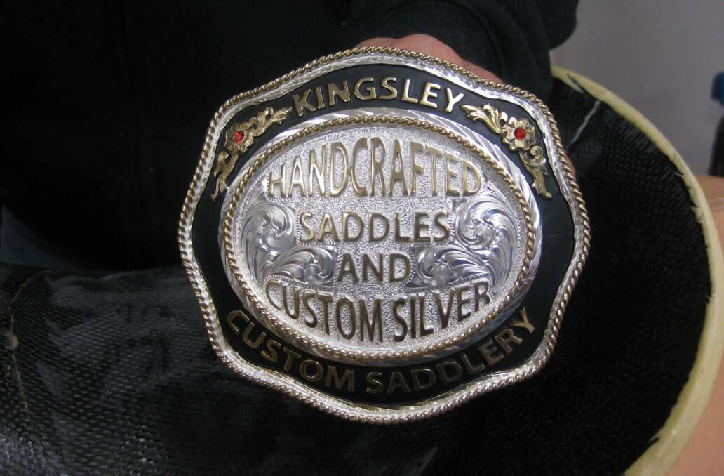 CRAFTSMANSHIP: This silver belt buckle is part of a new line of decorative items designed by Kingsley Custom Saddlery.