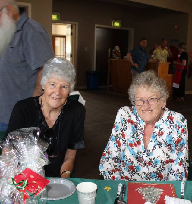 CHRISTMAS FUN: Joy Anthony and Laurel McCarthy enjoyed a chat at the Progress Associations annual  Christmas Lunch.