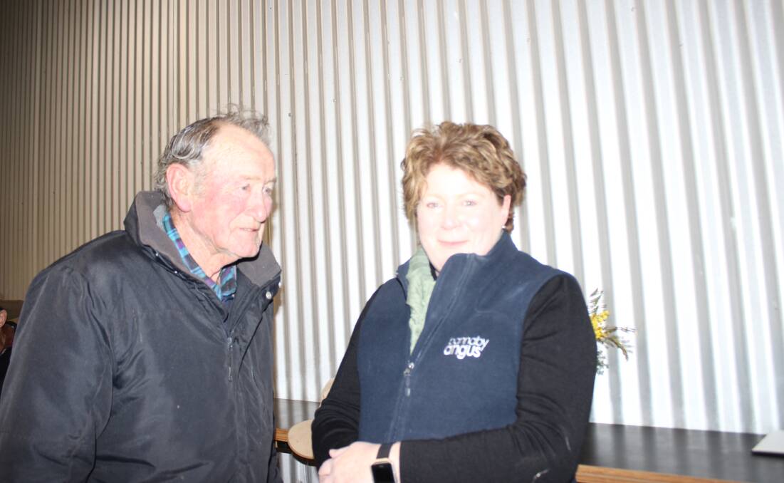 CATCH UP: A busy Cherie Langford took time to have a chat with her father Col Kennedy before the sale of Bannaby Angus on Saturday.