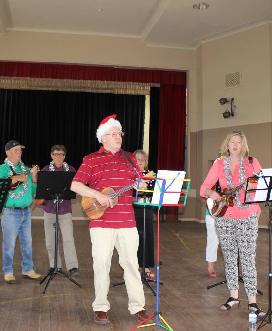 STRUM CHUMS: The popular Ukulele Group played during the Progress Association Christmas lunch in the Memorial Hall on Friday. Photos: supplied