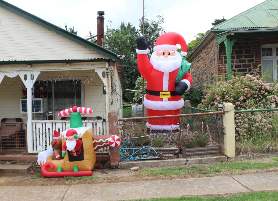 STREET SCENE: Already households are decorating their residences with Christmas themes. Kerrie says the Hollis Santa Claus is four feet high.