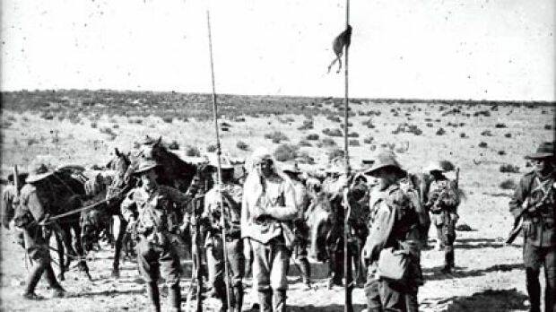 FROM THE ARCHIVES: Light Horse soldiers after making a capture near Beersheba. Image courtesy of the Australian War Memorial.