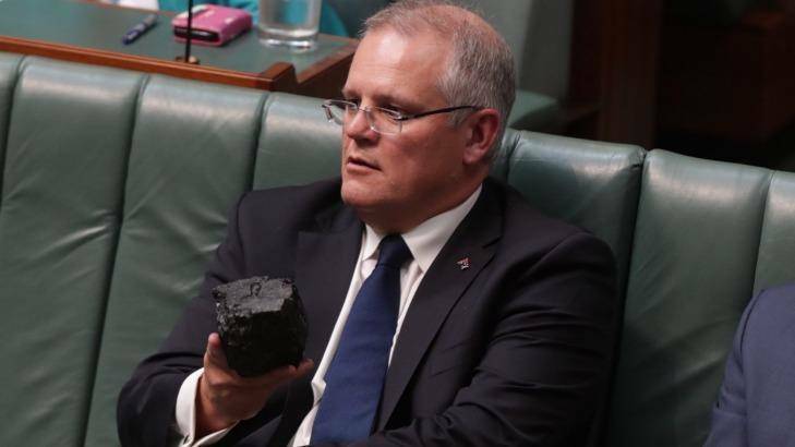 Federal Treasurer Scott Morrison with a lump of coal he took into Parliament as prop for debate on fossil fuels and energy sources. Photo: Andrew Meares