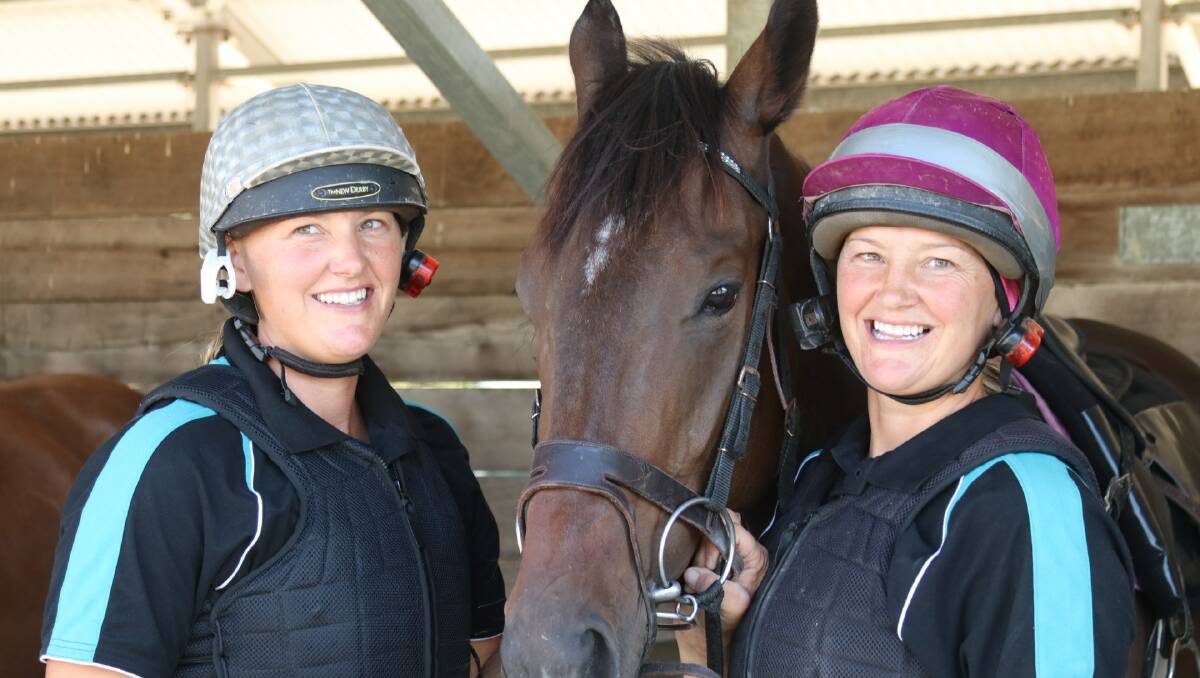 Twin sisters Emma and Lucy Longmire, pictured with Ribs from Twin Star Racing in Goulburn. Stablemate Riverset won race 4 on Monday with apprentice Chelsea Macfarlane. Photo: GDRC