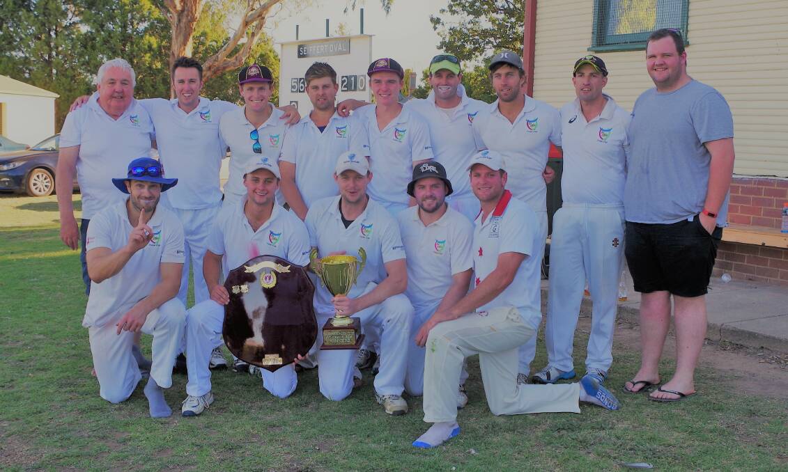 VICTORIOUS: Hibo Gold hold the Goulburn District Cricket Association grand final trophy after their decisive win on Saturday. Photo: Darryl Fernance