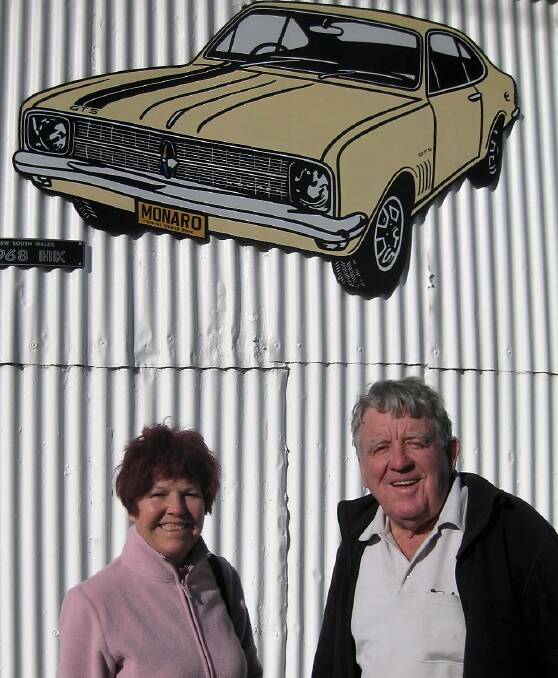 Visitors: Pam and Mike Hayes of Wellington under the HK Premier depicted on the Gunning Wall of Fame. Mike paid $2500 for his in 1968, a 'Show and Shine' winner.