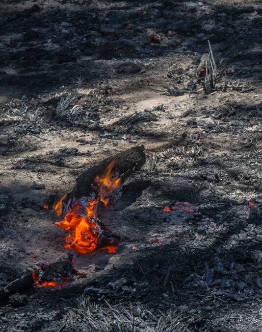 Burning embers at the Tarago/Currandooley fire on Wednesday. Photo: Karleen Minney