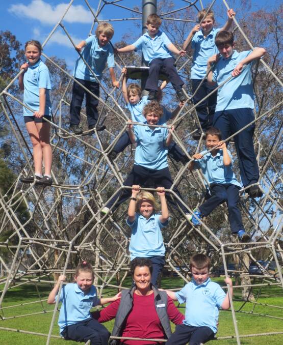 LOOK BACK: In 2016, the whole school group at Dalton Public took a road trip to Canberra, including to a Belconnen park for lunch and playtime. Photo: supplied