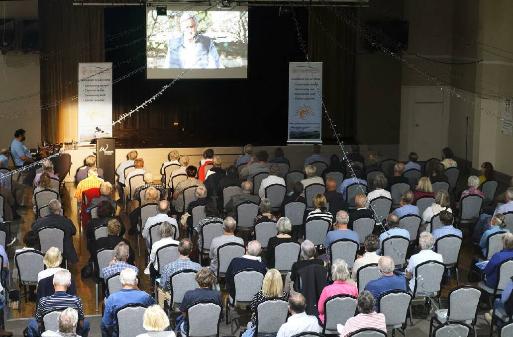 An attentive COVID-distanced audience watch an introductory video from John Hewson, CE4G chair and former Liberal leader. Picture: Nic Fraser.