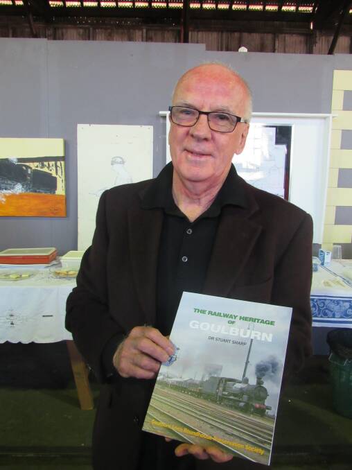 HISTORY: Richard Barrack from Train Hobby Publications with Dr Stuart Sharp's new book 'The Railway Heritage of Goulburn'. Photo: Olivia Taylor