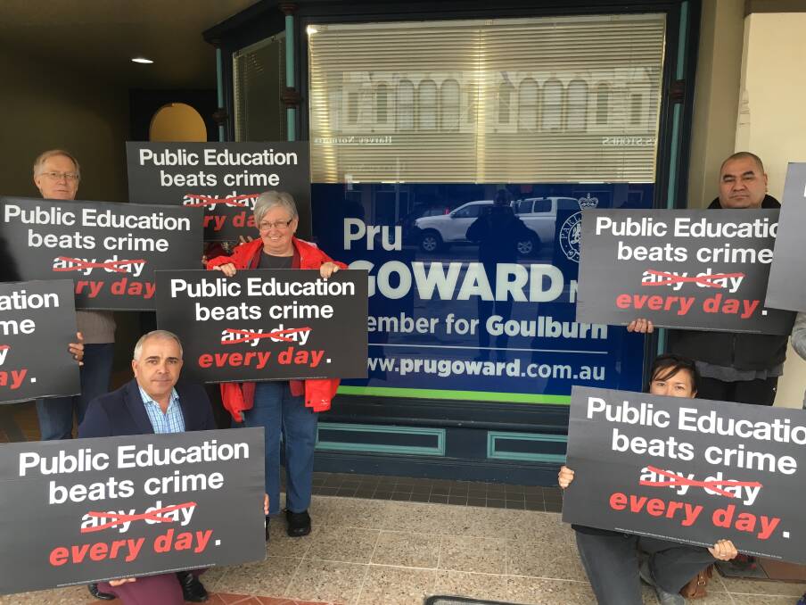 PROTEST: Teachers Federation organiser Waine Donovan (front left) with some of the teachers from Goulburn Correctional Centre outside Goulburn MP Pru Goward's office on Wednesday, asking for their jobs to be saved. Photo: David Cole