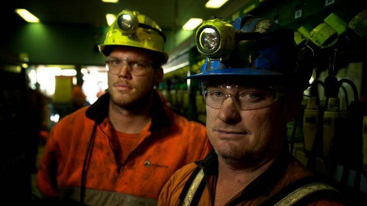 Adam Powell and Darrin Francis in the Springvale mine lamp room after their shift. Photo: Wolter Peeters