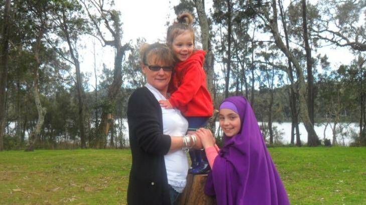 Sydney woman Karen Nettleton pictured with two of her grandchildren who are now trapped in Syria. Photo: Supplied