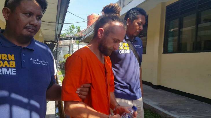 David Taylor is taken from a holding cell to undergo psychological testing.   Photo: Amilia Rosa