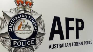The AFP has charged a Sudanese man for letting his electronic monitoring device go flat. (Julian Smith/AAP PHOTOS)