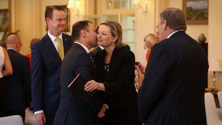 Minister for Health Sussan Ley is embraced by Assistant Treasurer Josh Frydenberg.  Photo: Andrew Meares