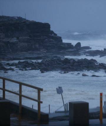 Rain and big waves lash Clovelly as a storm rolls across Sydney. Photo: Peter Rae