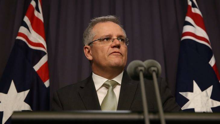 Immigration Minister Scott Morrison has announced a deal with Clive Palmer to reintroduce temporary protection visas for asylum seekers. Photo: Andrew Meares