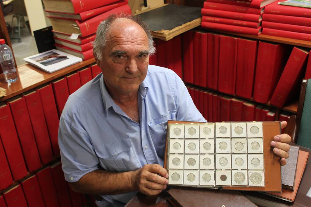 IN THE MONEY: Goulburn man Richard Cudaj with some of his coin collection. Here he displays his shillings and 1937 and 1938 crowns (the bottom two large coins). Photo: David Cole