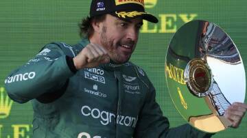Fernando Alonso will race for Aston Martin for at least two more years after a contract extension. (AP PHOTO)