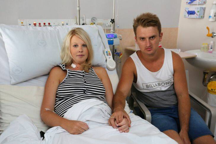 Kiama Down's Kane and Ashley Buchanan, pictured after Ashley's emergency caesarean after contracting food poisoning from a Sylvania bakery. Picture: Kirk Gilmour