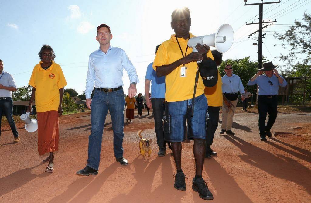 Prime Minister Tony Abbott joins school attendance officers on the walking bus in Yirrkala during his visit to North East Arnhem Land on Wednesday. Photo: Alex Ellinghausen