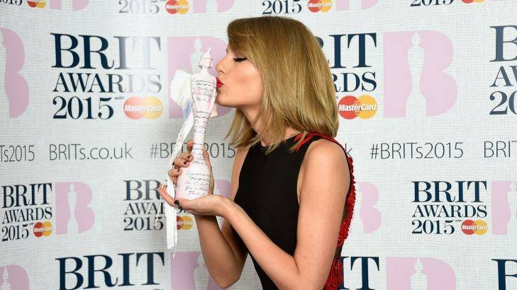 Taylor Swift poses with her International Female Solo Artist Award at the BRIT Awards on February 25, 2015 in London. Photo: Ian Gavan