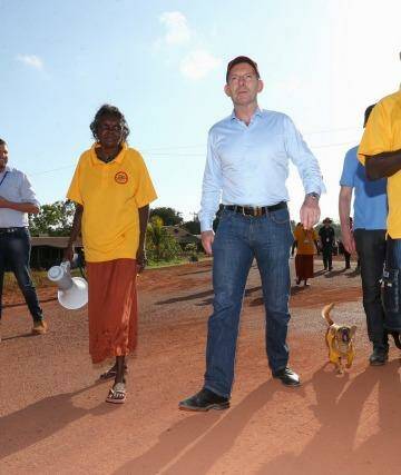 Prime Minister Tony Abbott joins school attendance officers on the walking bus in Yirrkala during his visit to North East Arnhem Land on Wednesday. Photo: Alex Ellinghausen