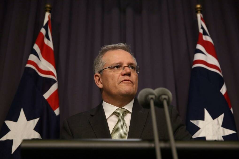 Immigration Minister Scott Morrison has announced a deal with Clive Palmer to reintroduce temporary protection visas for asylum seekers. Photo: Andrew Meares